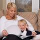 Mother and daughter reading a book together... (thumbnail)