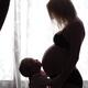 Daughter Hugging Her Pregnant Mother Around Belly... (thumbnail)