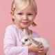 Smiling girl with a bunny in hands... (thumbnail)