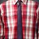 Man wearing red tartan shirt with a skinny necktie... (thumbnail)