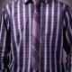 Man wearing a blue tartan shirt with a slim tie... (thumbnail)