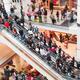 Blurred with motion people on escalator in shopping mall... (thumbnail)