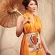 Asian woman in orage dress with umbrella... (thumbnail)