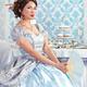 Beautiful asian lady sitting with a fan at a table... (thumbnail)