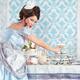 Lady taking a cupcake from a table... (thumbnail)