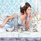 Beautiful woman lying on a tea party table... (thumbnail)