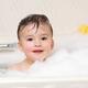Cute little child enjoying a foam bath... (thumbnail)