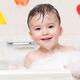 Cute smiling baby boy enjoying a foam bath... (thumbnail)