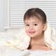 Cute smiling baby boy under a blanket... (thumbnail)