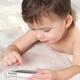 Child with an iPhone in bed... (thumbnail)