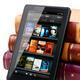 Amazon Kindle Fire leaning against hardcover books... (thumbnail)