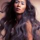 Artistic portrait of a beautiful young woman with long wavy hair... (thumbnail)