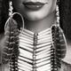 Closeup of lips of a woman wearing aboriginal necklace and feathers... (thumbnail)
