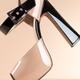 Fashionable high heel shoe on beige... (thumbnail)