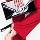 Woman in red suit and platform shoes with a clutch... (thumbnail)