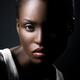 Dramatic portrait of a young black african american woman face... (thumbnail)