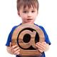Boy holding email symbol at in his hands... (thumbnail)