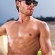 Young man in sunglasses at the beach... (thumbnail)