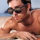 Man in sunglasses at the beach closeup of face... (thumbnail)