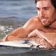 Happy young man with surfboard in water... (thumbnail)