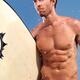 Young man with a surfboard going surfing in the sea... (thumbnail)