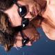 Young man in sunglasses lying in the sun... (thumbnail)
