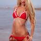 Sexy woman with blond hair wearing red bikini swimsuit... (thumbnail)