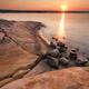 Red rocks on a shore of Georgian Bay during sunrise... (thumbnail)