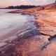 Red rocks on a lake shore at dawn... (thumbnail)