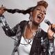 Artistic photo of woman singing in microphone... (thumbnail)