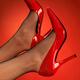 Woman legs in red high heel shoes up in the air... (thumbnail)