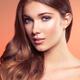 Beauty portrait of a young woman face with wavy brown hair neatly brus... (thumbnail)