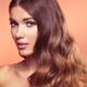 Woman with beautiful long wavy brown hair Beauty face portrait... (thumbnail)