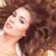 Beautiful woman with long hair spread around her... (thumbnail)