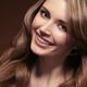 Beauty portrait of a young smiling woman with brown hair... (thumbnail)