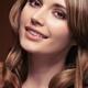 Portrait of a smiling beautiful woman with long brown hair... (thumbnail)