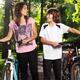 Children with bicycles wallking in park... (thumbnail)