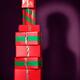 Red presents stacked in shape of bottle... (thumbnail)