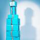 Blue gift wrapped presents stacked in shape of bottle... (thumbnail)