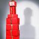 Red gift wrapped presents stacked in shape of bottle... (thumbnail)