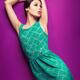 Young woman wearing green vintage style dress... (thumbnail)