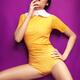 Young woman in bright yellow vintage style clothes... (thumbnail)