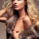 Beautiful woman with flying blond hair wearing fur over bare body Char... (thumbnail)