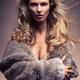 Beautiful woman with flying blond hair wearing fur Charlie Riina... (thumbnail)