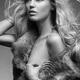 Beauty portrait of woman with blond hair wearing fur vest over bare bo... (thumbnail)