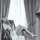 Beautiful young woman in a rocking chair Black and white... (thumbnail)