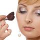 Young woman having her makeup applied... (thumbnail)