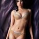 Young woman wearing beige lingerie... (thumbnail)