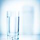 Glass of water on light blue background... (thumbnail)
