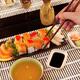 Person eating sushi at Japanese restaurant... (thumbnail)